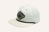 The Zilker Sessions Rope Hat by Zilker Belts is a white baseball cap featuring a colorful embroidered patch of a cowboy riding a horse on the front.